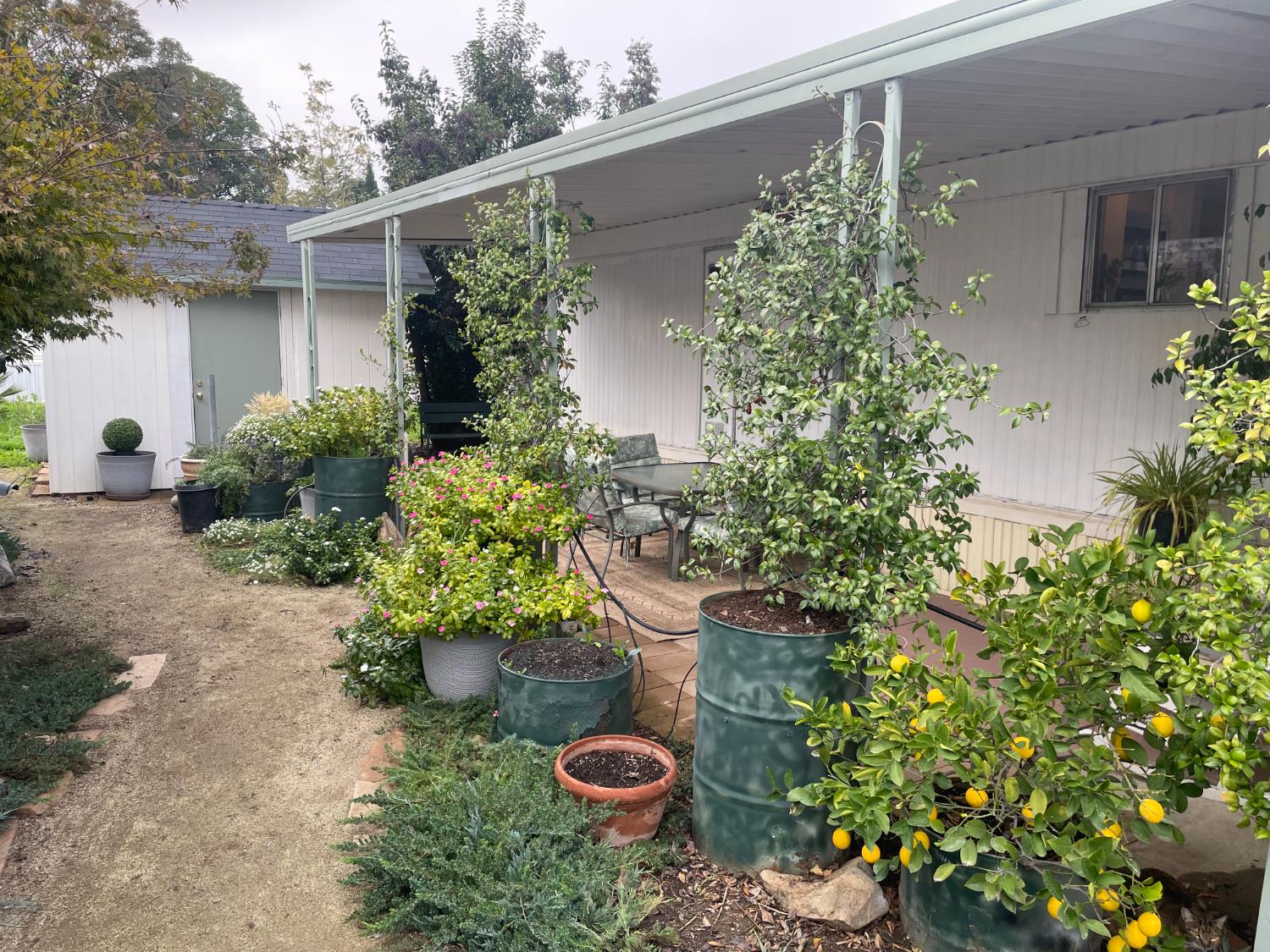 5835 Cherokee Road, Unit 42 Stockton, CA 95215 - Photo 15 of 24 a backyard of a house with a yard and outdoor seating