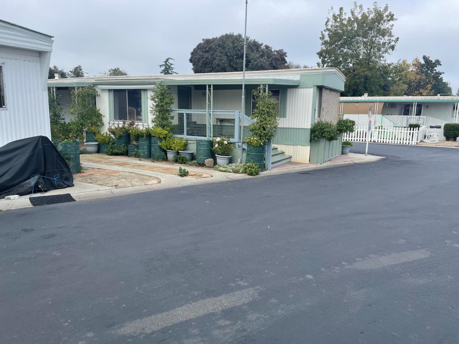 5835 Cherokee Road, Unit 42 Stockton, CA 95215 - Photo 19 of 24 a front view of a house with garden