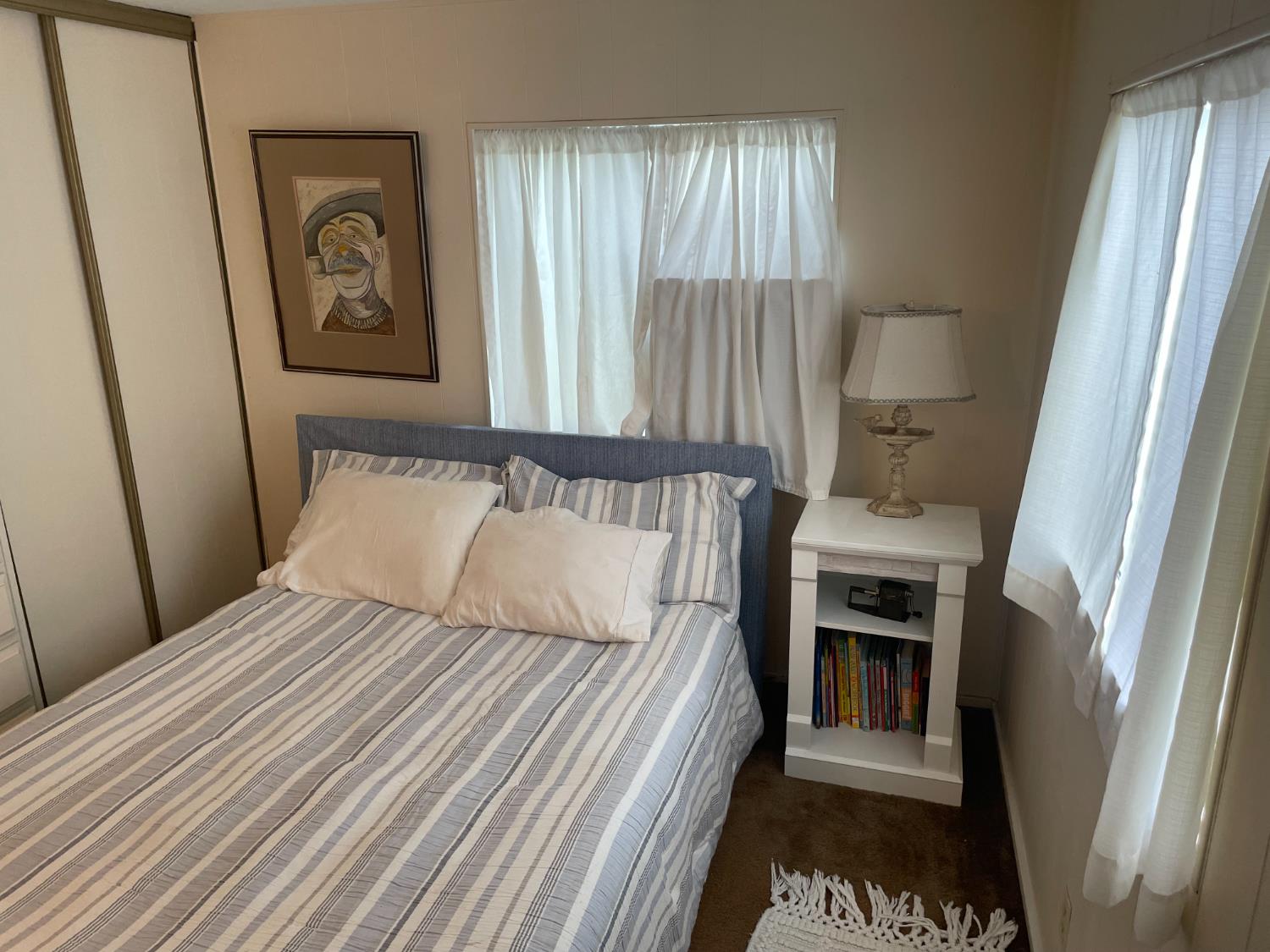 5835 Cherokee Road, Unit 42 Stockton, CA 95215 - Photo 4 of 24 a bedroom with a bed and a window