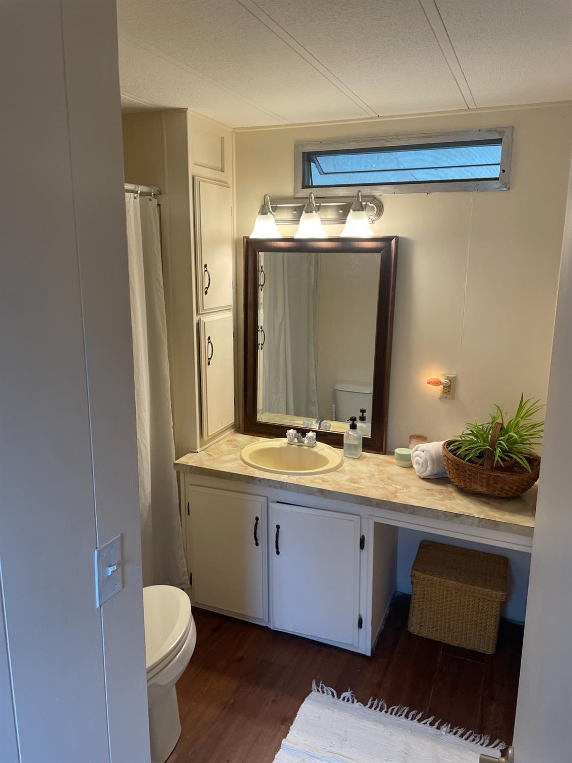 5835 Cherokee Road, Unit 42 Stockton, CA 95215 - Photo 6 of 24 a bathroom with a granite countertop sink a toilet and a mirror