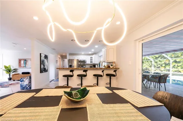a living room with furniture a rug and a large window