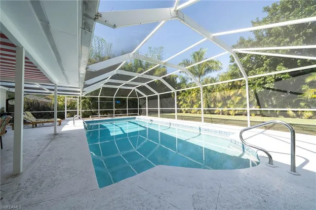 a view of a swimming pool with a porch