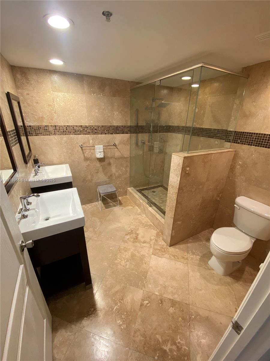 110 North Federal Highway, Unit 705 Fort Lauderdale, FL 33301 - Photo 5 of 16 a bathroom with a sink and a toilet