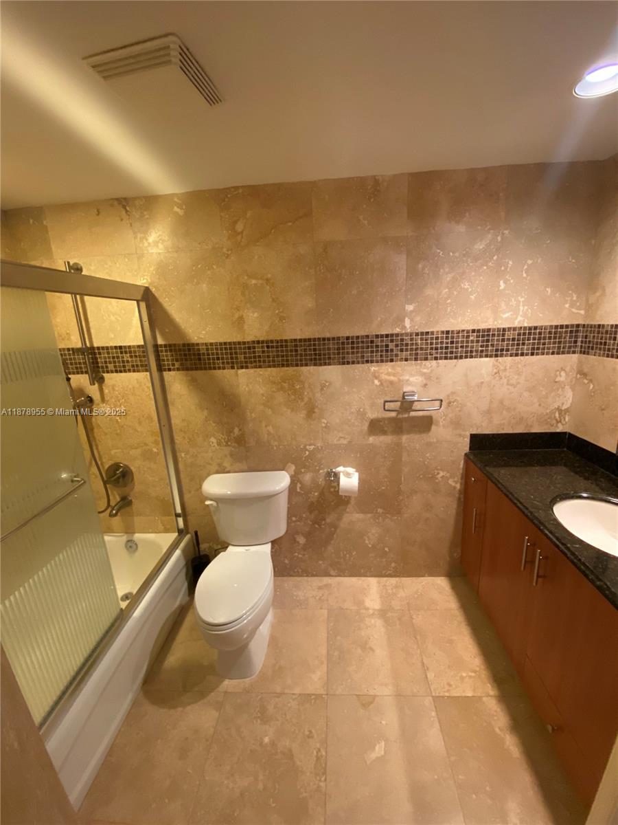 110 North Federal Highway, Unit 705 Fort Lauderdale, FL 33301 - Photo 8 of 16 a bathroom with a toilet and a shower