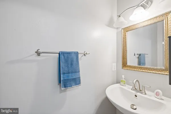 a bathroom with a sink and mirror