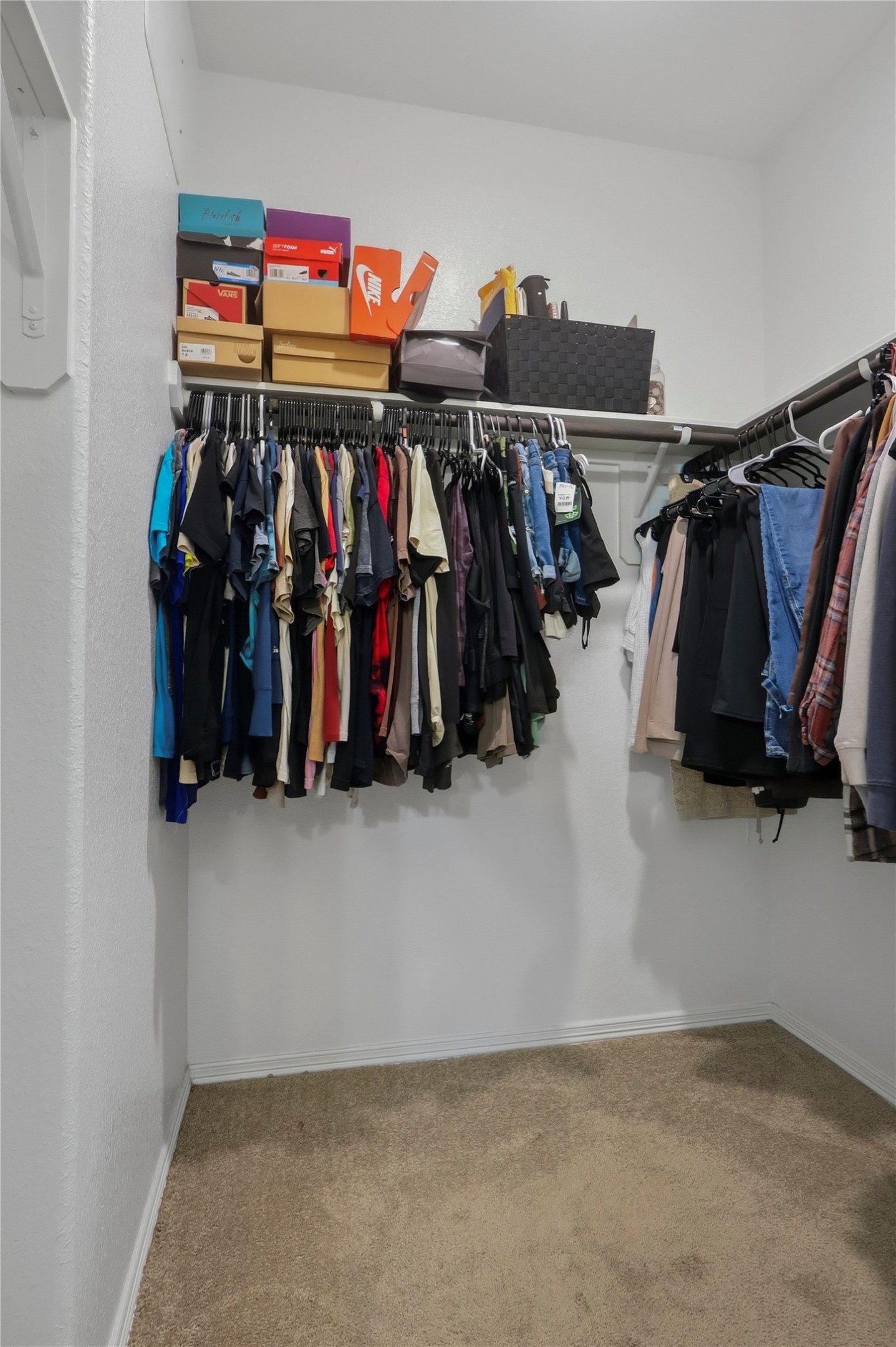 9938 Yanet Grove Lane Houston, TX 77044 - Photo 12 of 21 a view of walk in closet with clothes