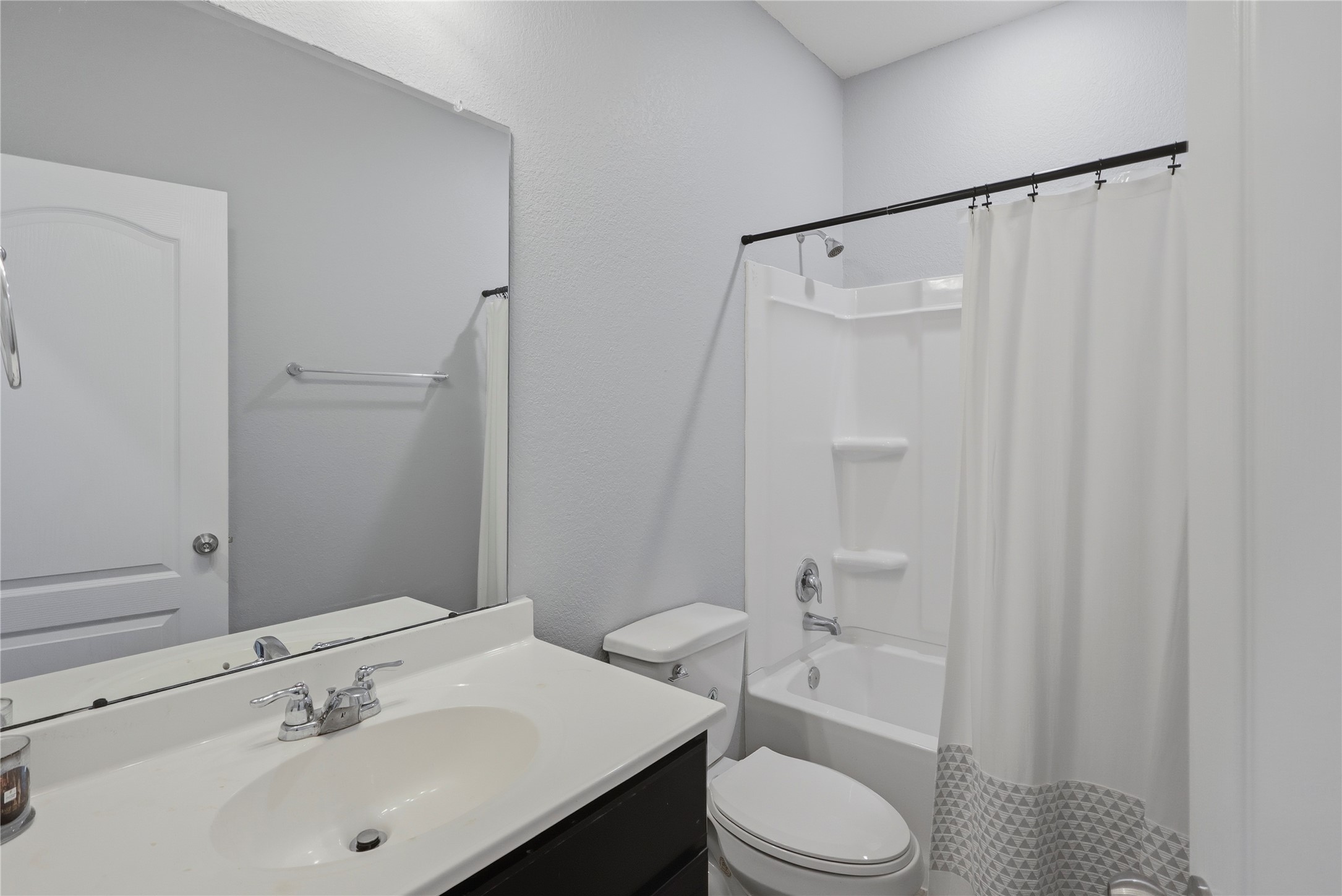 9938 Yanet Grove Lane Houston, TX 77044 - Photo 15 of 21 a bathroom with a sink toilet and shower