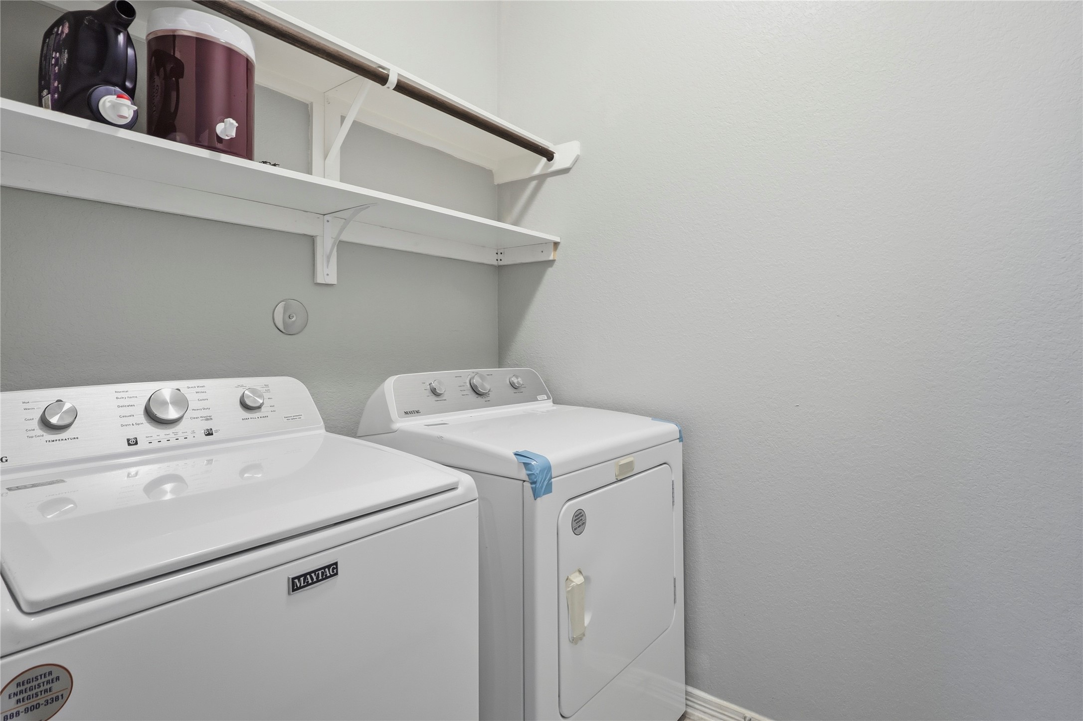 9938 Yanet Grove Lane Houston, TX 77044 - Photo 17 of 21 a utility room with dryer and washer