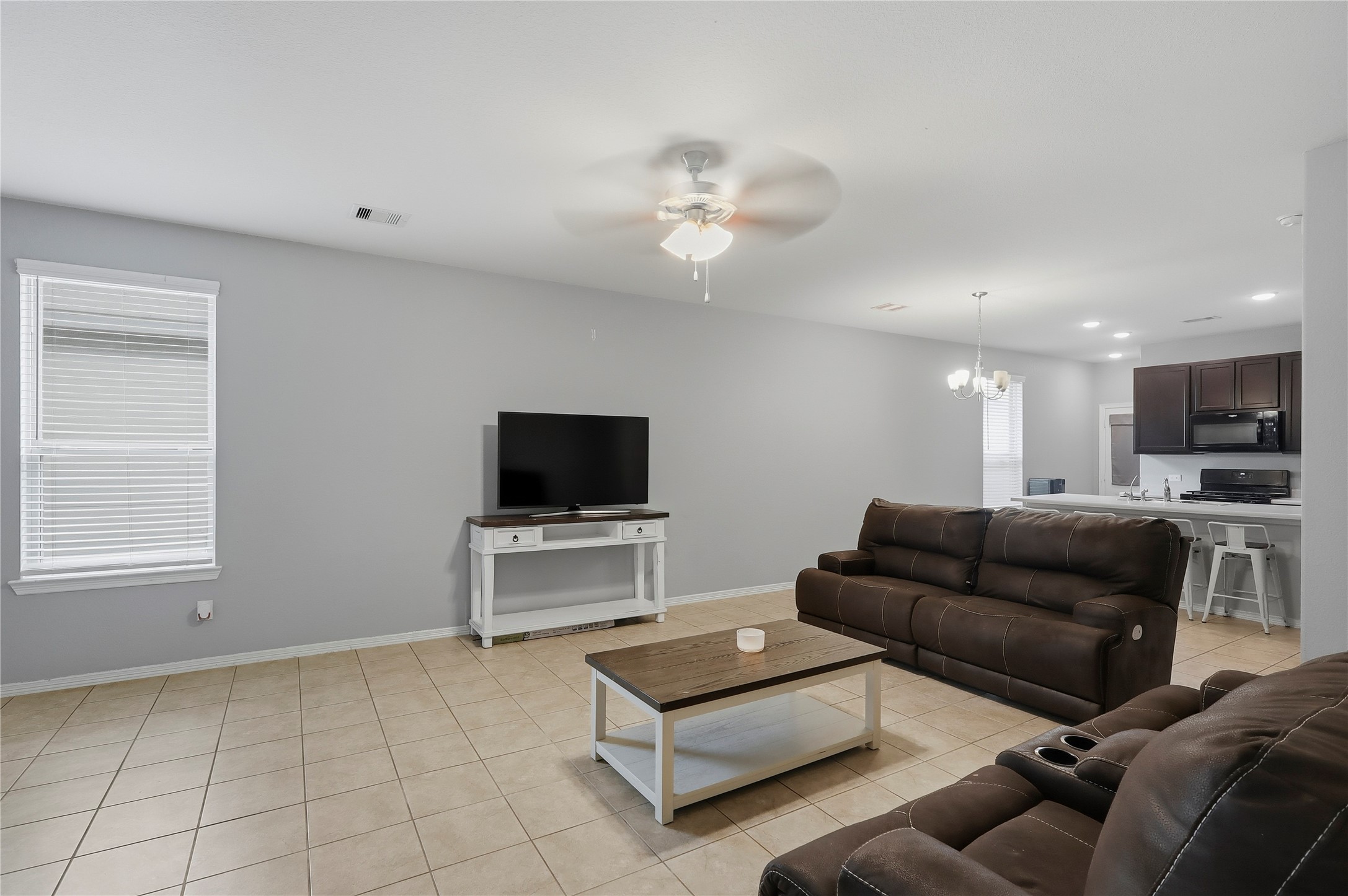 9938 Yanet Grove Lane Houston, TX 77044 - Photo 4 of 21 a living room with furniture and a flat screen tv