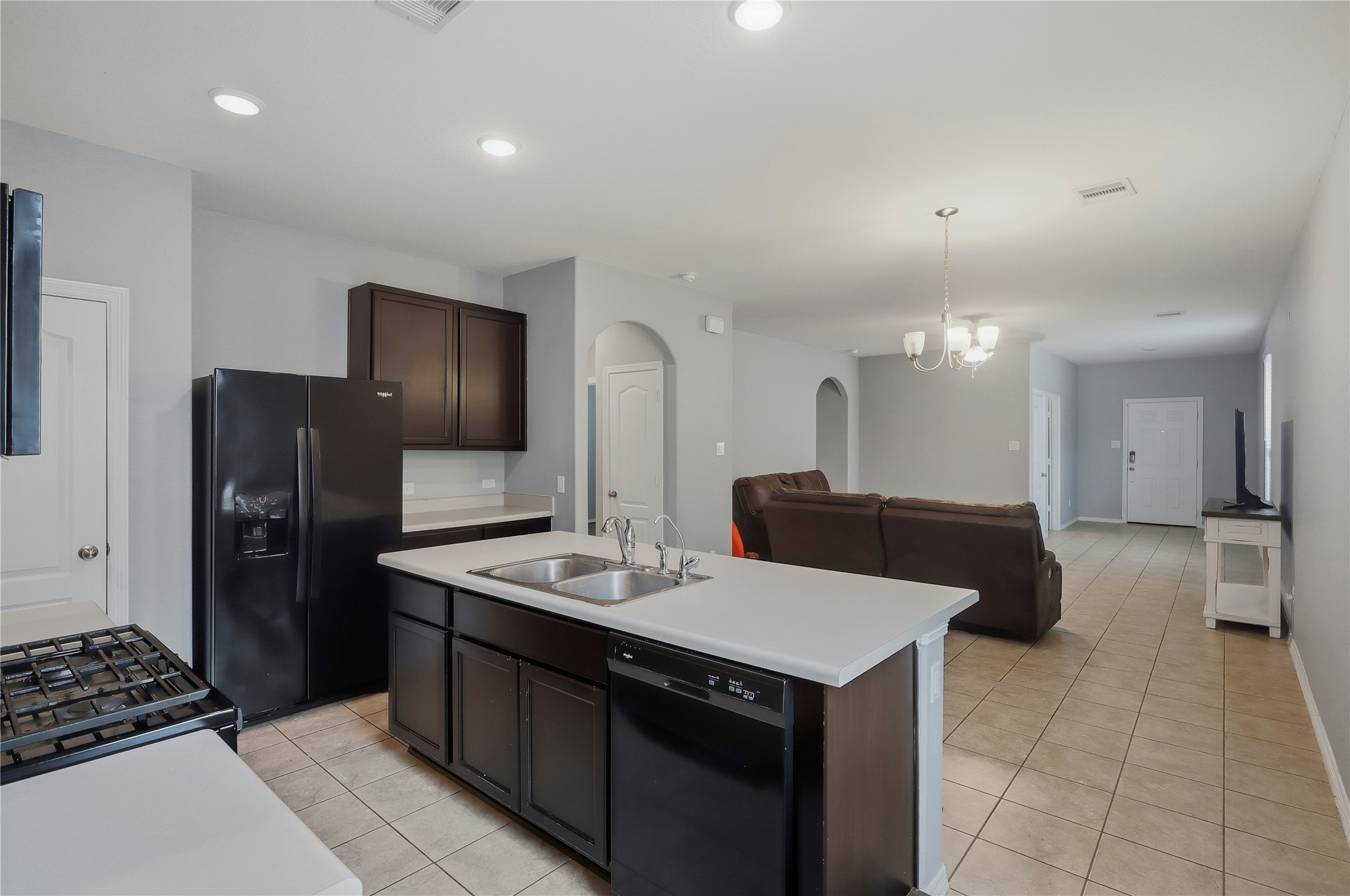 9938 Yanet Grove Lane Houston, TX 77044 - Photo 7 of 21 a kitchen with a sink appliances and cabinets
