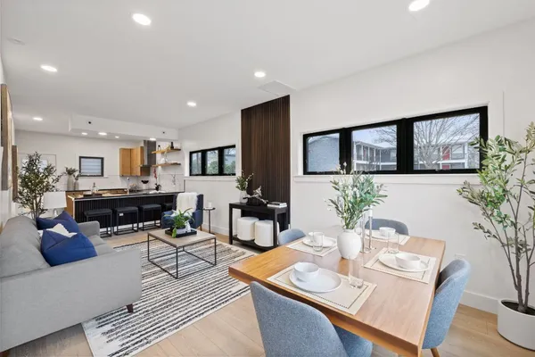a living room with furniture and a table