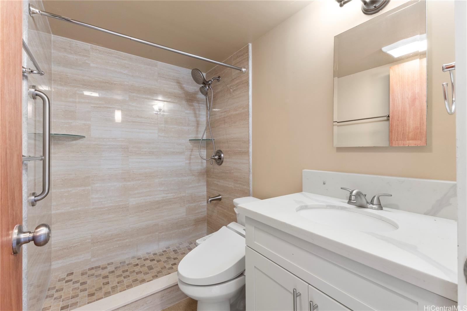 633 Nalanui Street, Unit 409 Honolulu, HI 96817 - Photo 8 of 15 a bathroom with a sink toilet and shower