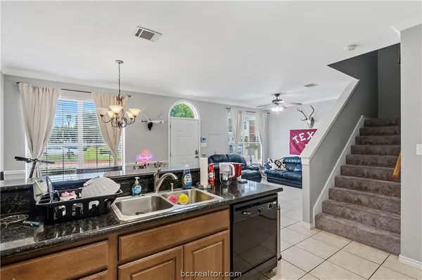 a kitchen with sink and window