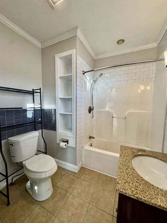 6 Gould Street, Unit 2 Stoneham, MA 02180 - Photo 14 of 27 a bathroom with a granite countertop toilet a sink and bathtub
