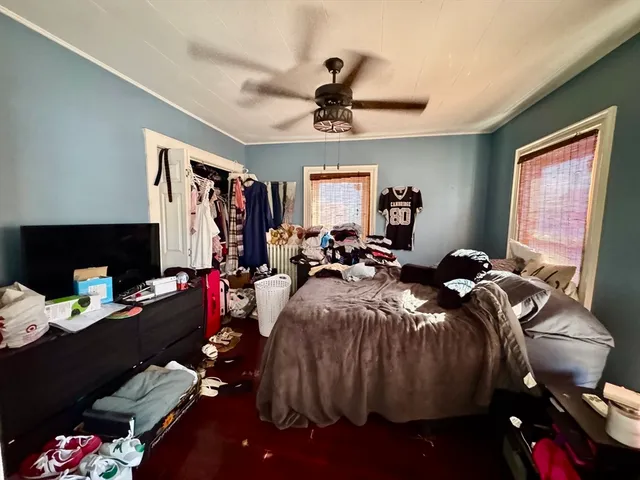 a bed room with a bed and a window