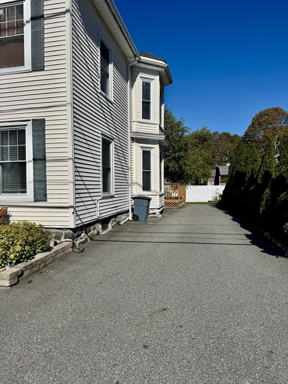 6 Gould Street, Unit 2 Stoneham, MA 02180 - Photo 2 of 27 front view of a house with a street