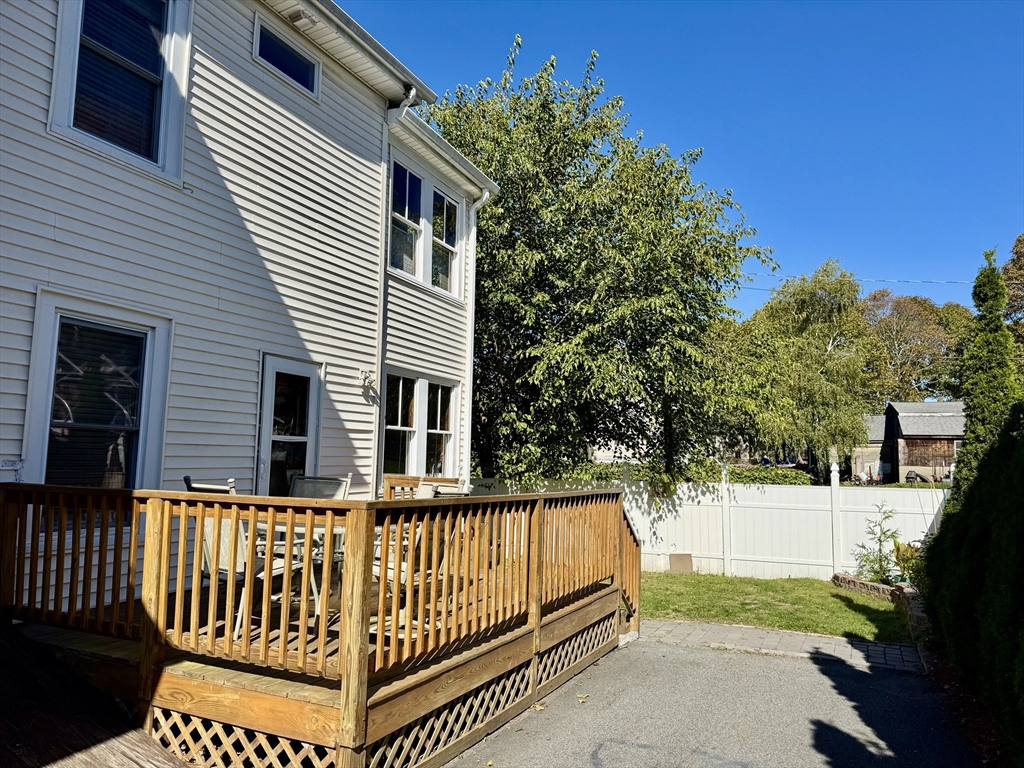6 Gould Street, Unit 2 Stoneham, MA 02180 - Photo 3 of 27 a view of a house with a yard