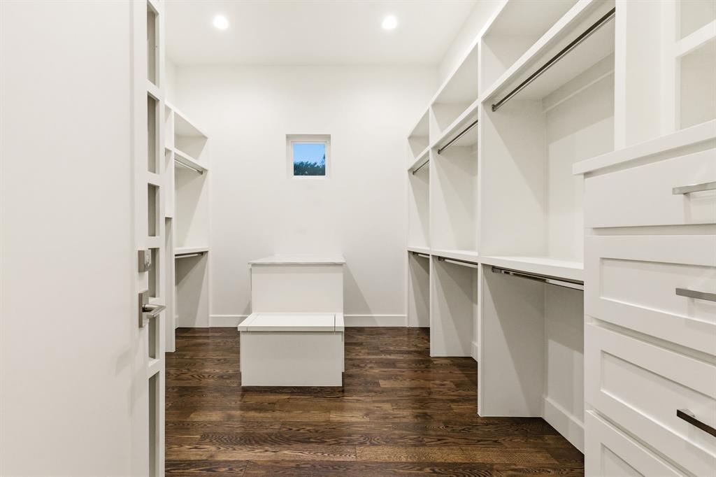 6523 Northwood Road Dallas, TX 75225 - Photo 22 of 36 a view of walk in closet with empty racks