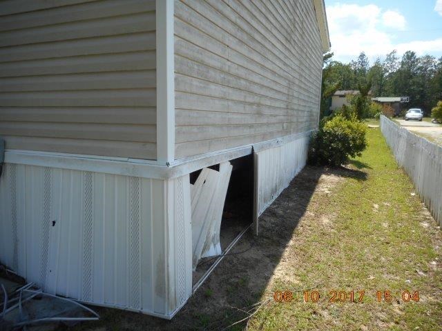 12 Whitening Road Butler, GA 31006 - Photo 5 of 12 a view of a pathway of a house