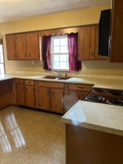 8707 Huber Road Belvidere, IL 61008 - Photo 7 of 13 a kitchen with stainless steel appliances granite countertop a sink and a stove
