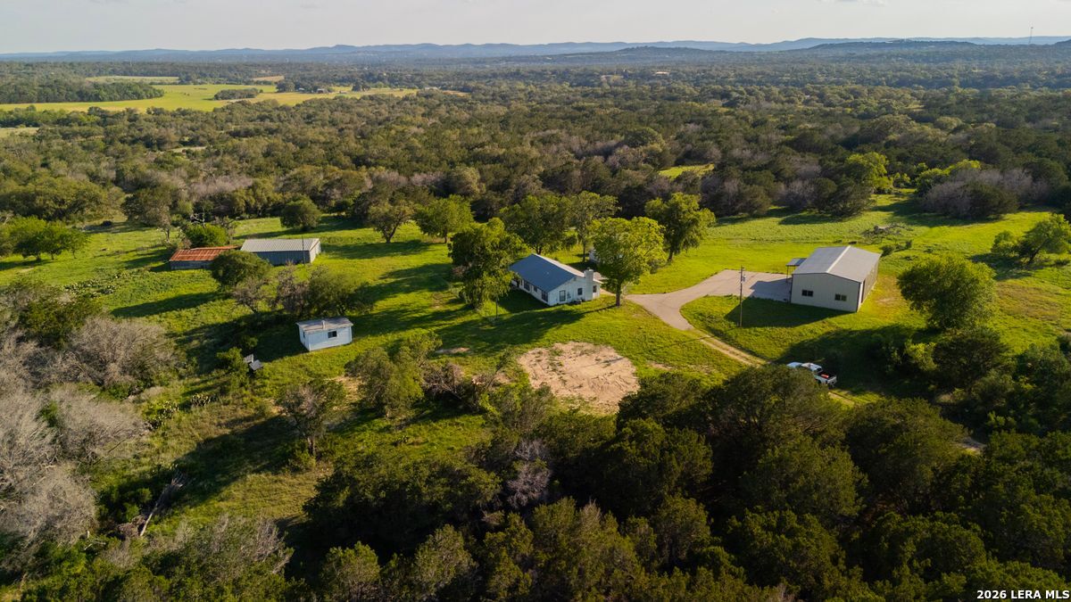 3584 Privilege Creek Road Pipe Creek, TX 78063 - Photo 26 of 44 an aerial view of residential houses with outdoor space