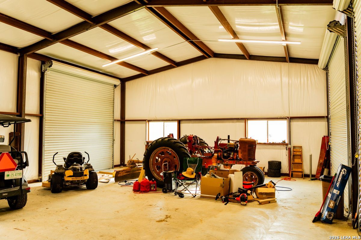 3584 Privilege Creek Road Pipe Creek, TX 78063 - Photo 30 of 44 a view of a garage with cars