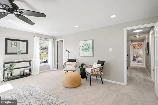 a bathroom with a double vanity sink mirror and toilet