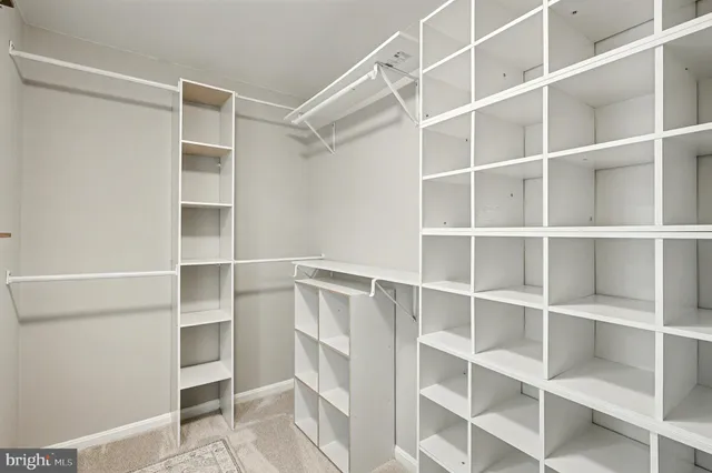 a spacious bedroom with a bed and a couch