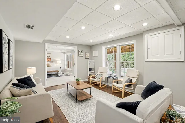 a kitchen with stainless steel appliances granite countertop a sink and a white cabinets