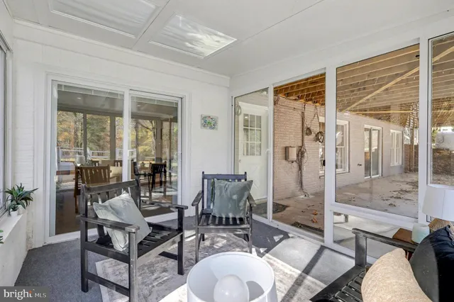 a bedroom with a bed and a large mirror