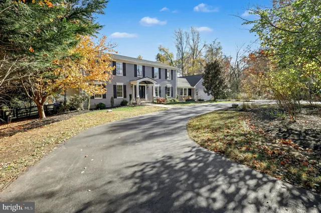 a view of a street with a building in the background