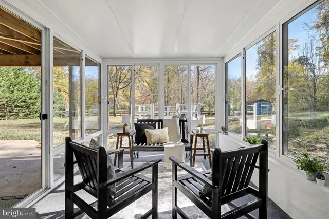 a bedroom with a large bed and a balcony view