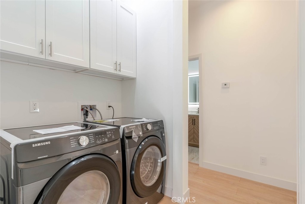 6852 Ranchito Avenue Van Nuys, CA 91405 - Photo 13 of 18 a utility room with dryer and washer