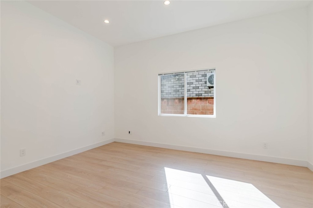 6852 Ranchito Avenue Van Nuys, CA 91405 - Photo 14 of 18 an empty room with a window