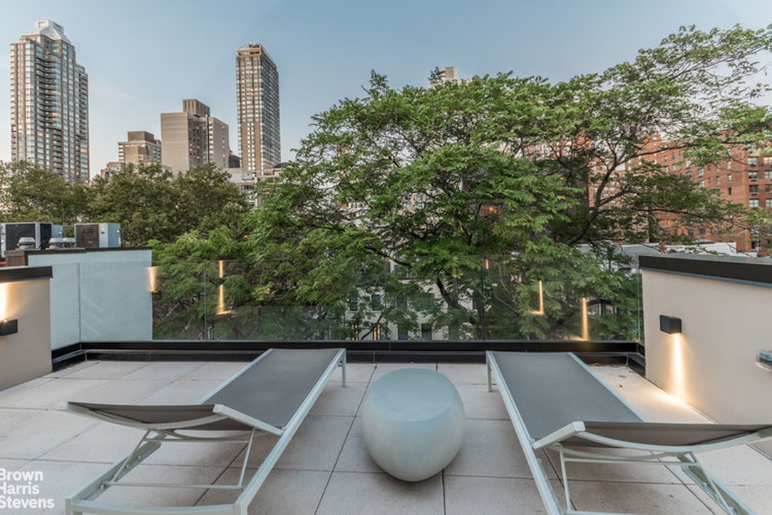 251 East 61st Street Manhattan, NY 10065 - Photo 4 of 39 a view of outdoor space with seating area