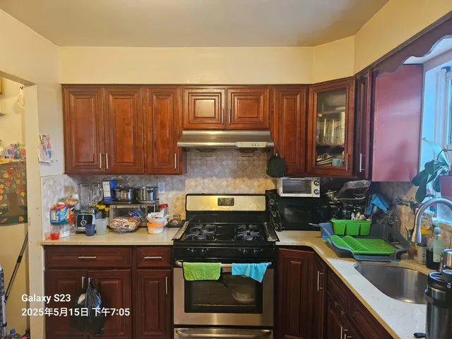 a room with table chairs and a potted plant