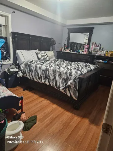 a bedroom with furniture and a window