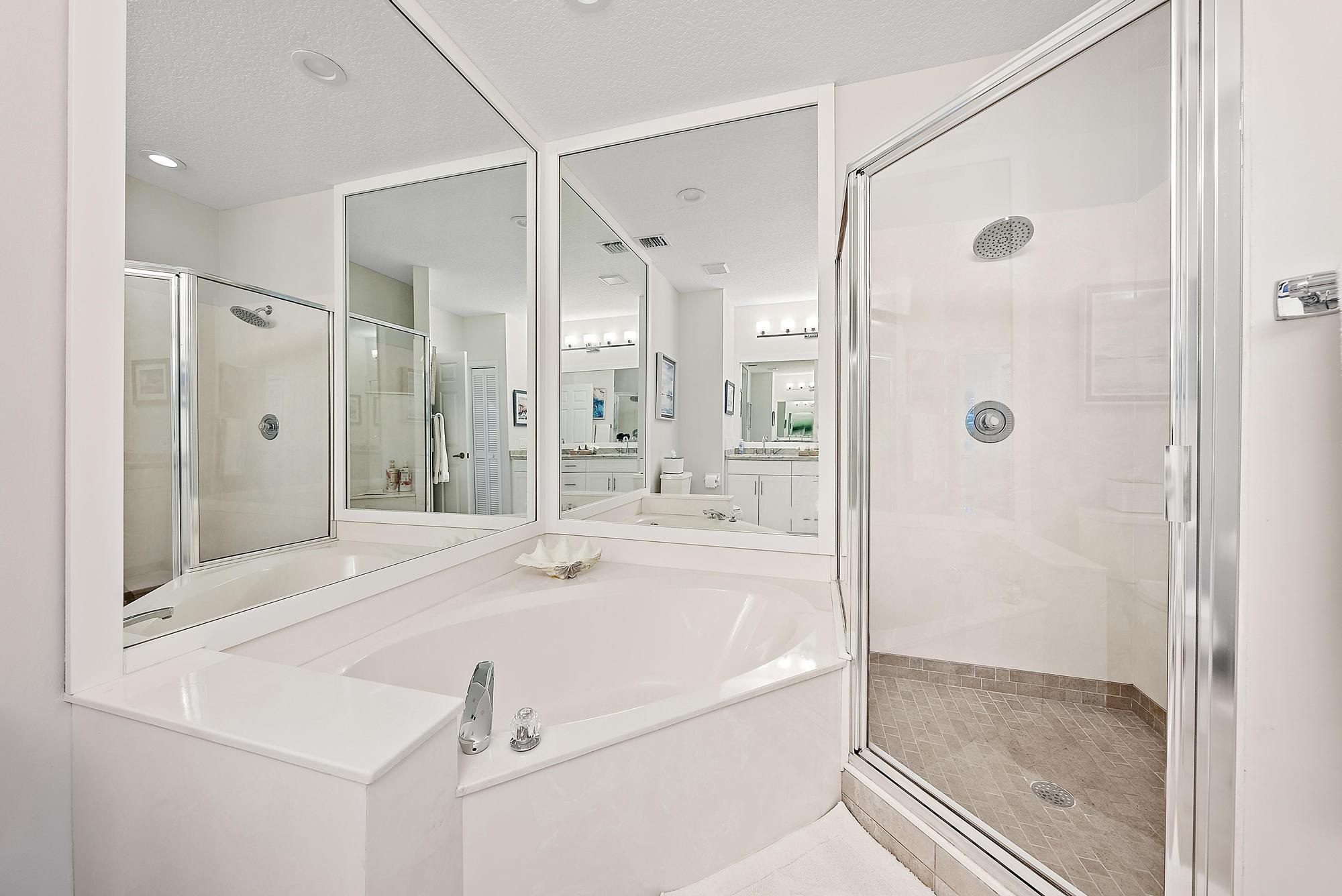 1000 North Us Highway, Unit 700 Jupiter, FL 33477 - Photo 15 of 32 a bathroom with a tub shower vanity and a sink