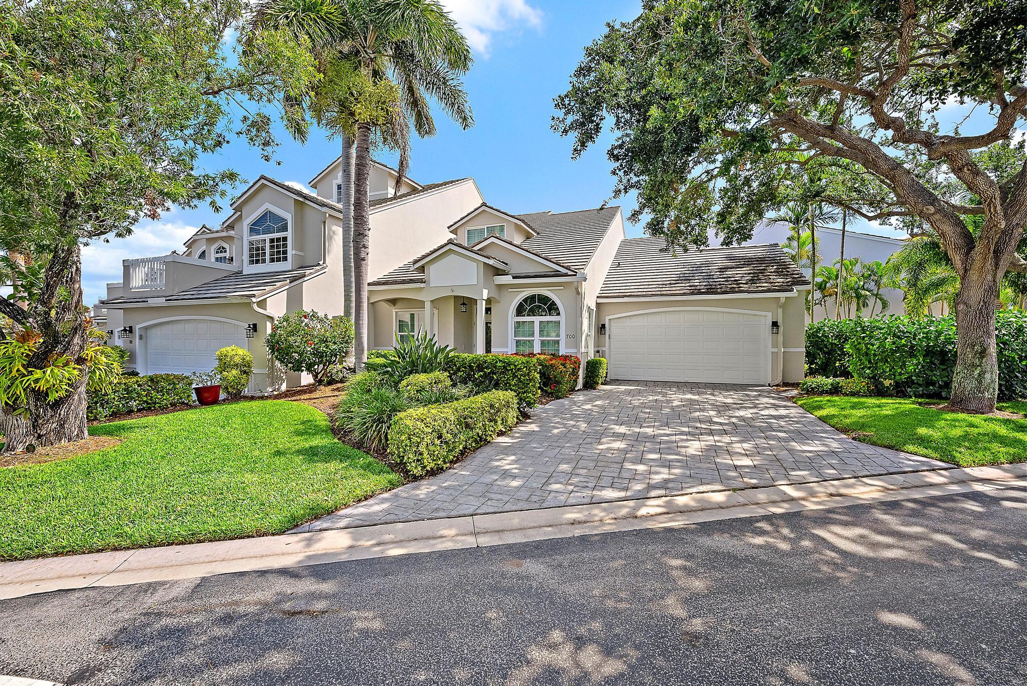 1000 North Us Highway, Unit 700 Jupiter, FL 33477 - Photo 2 of 32 a front view of a house with a garden and trees