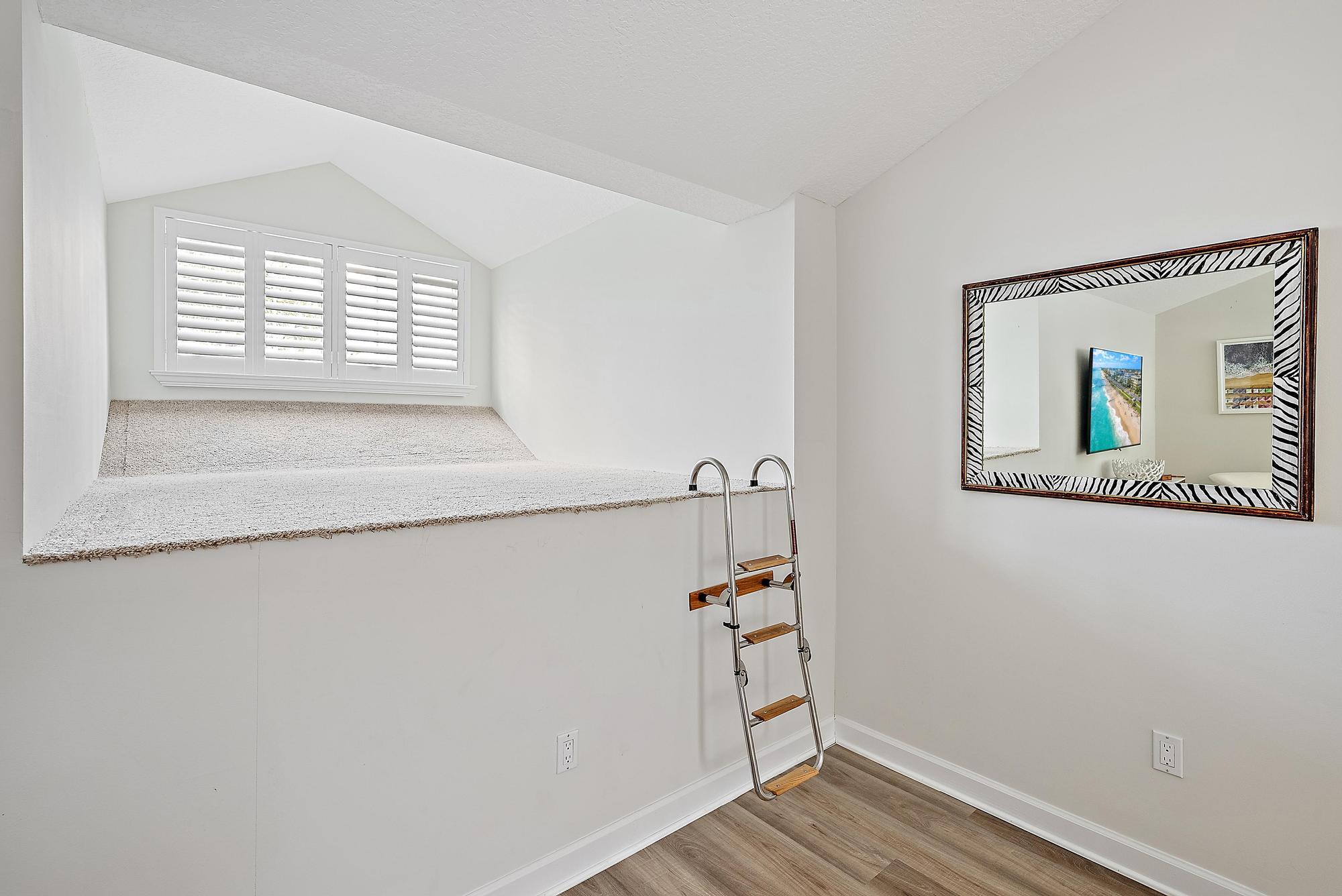 1000 North Us Highway, Unit 700 Jupiter, FL 33477 - Photo 21 of 32 a view of an empty room with wooden floor and a window