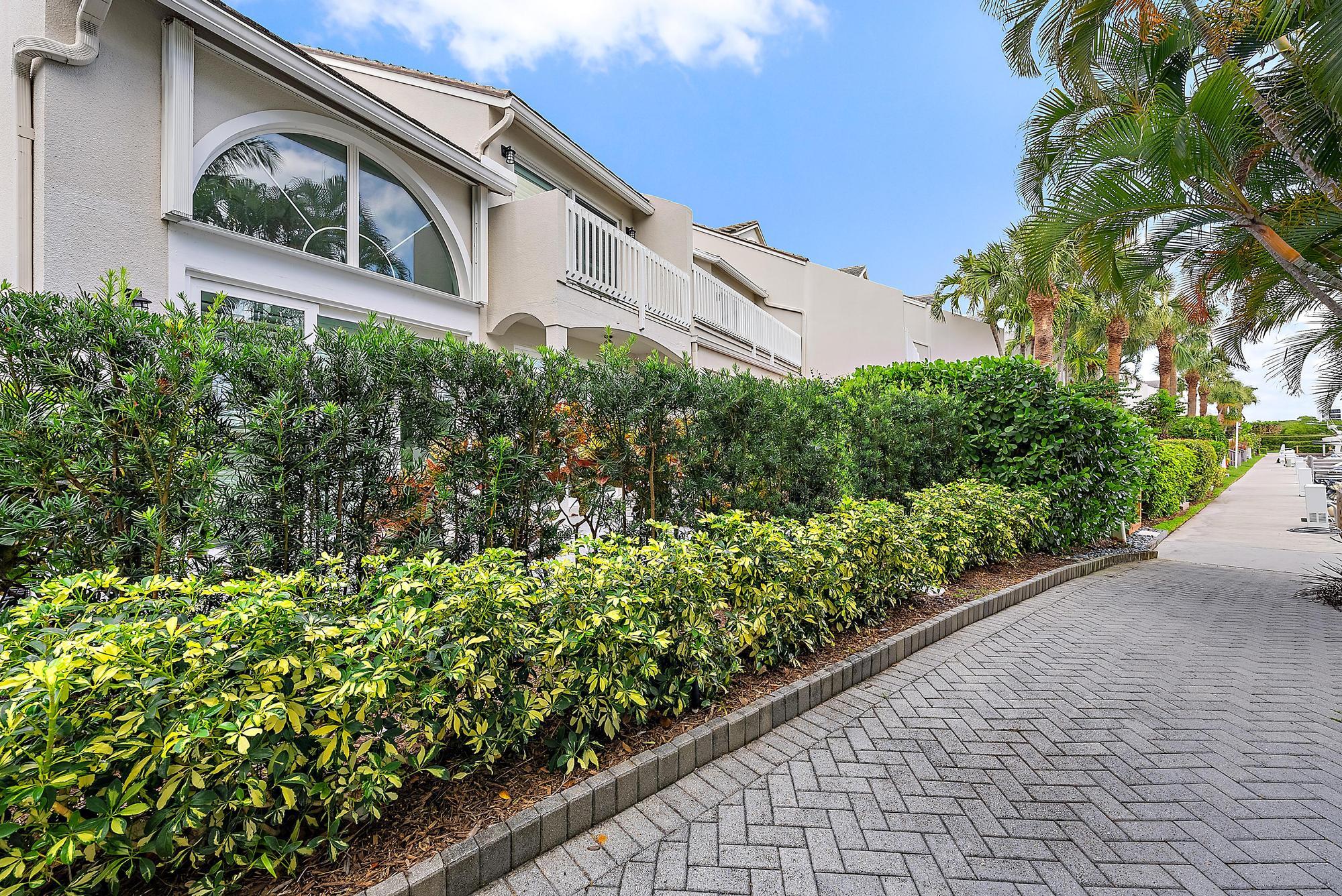 1000 North Us Highway, Unit 700 Jupiter, FL 33477 - Photo 27 of 32 a view of a garden with a pathway