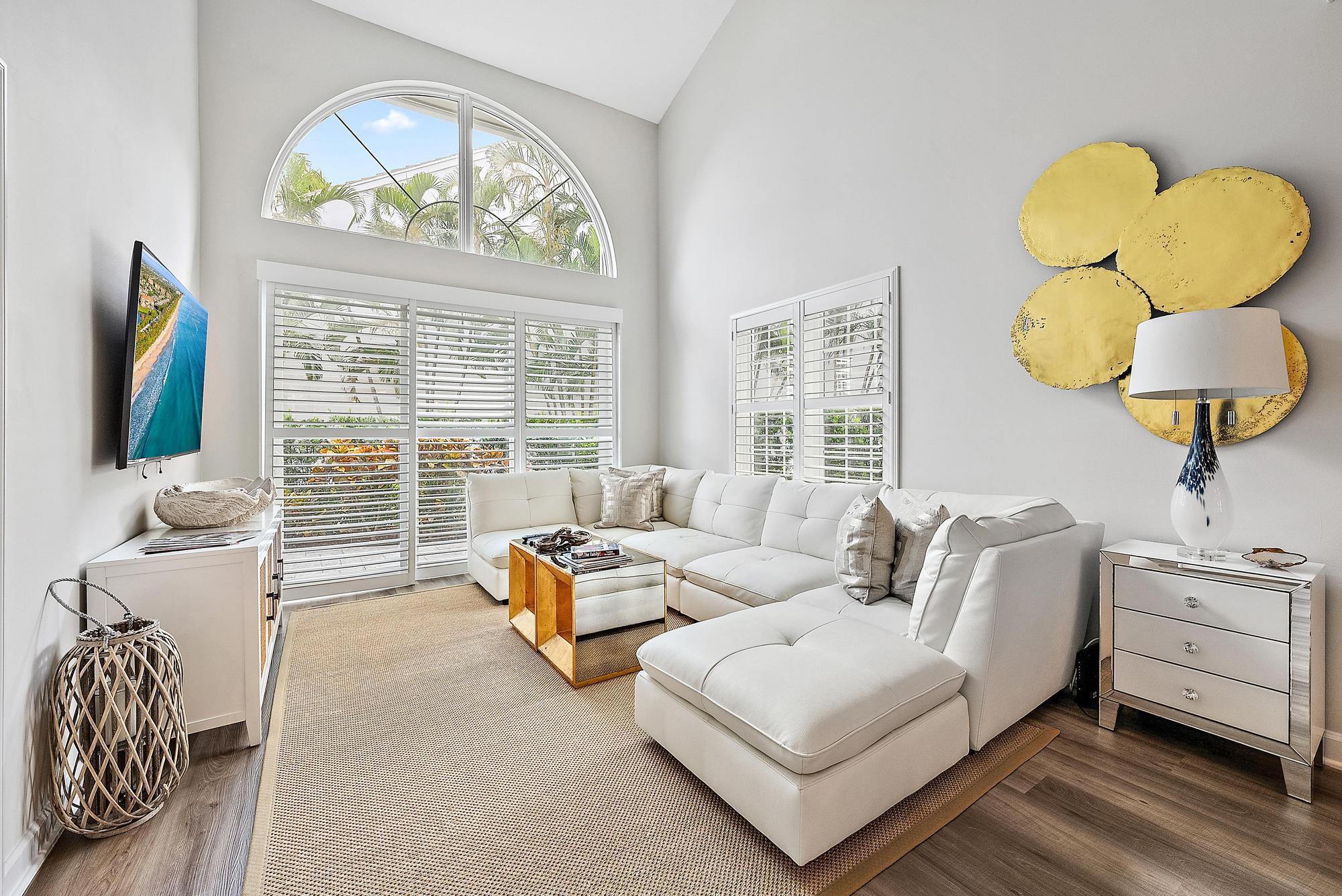 1000 North Us Highway, Unit 700 Jupiter, FL 33477 - Photo 10 of 32 a living room with furniture and a large window