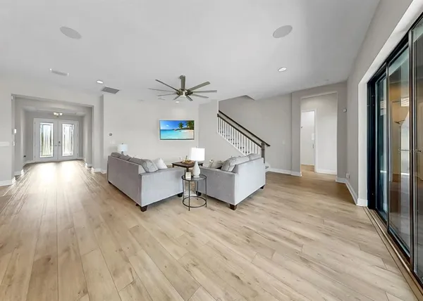 a living room with furniture and a large window