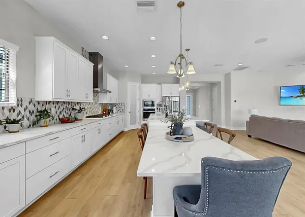 a kitchen with stainless steel appliances granite countertop a sink and cabinets
