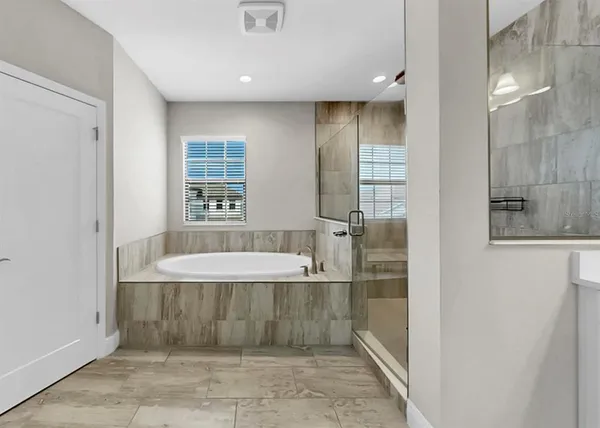 a bathroom with a toilet a sink and a shower
