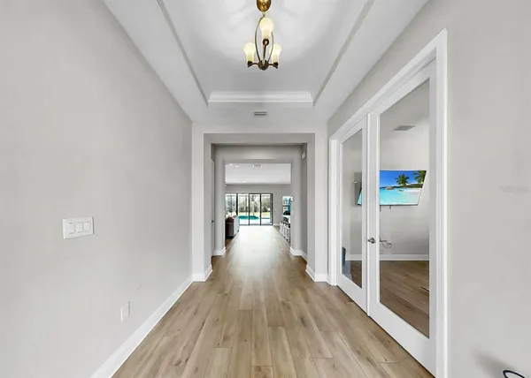 a view of gallery with wooden floor