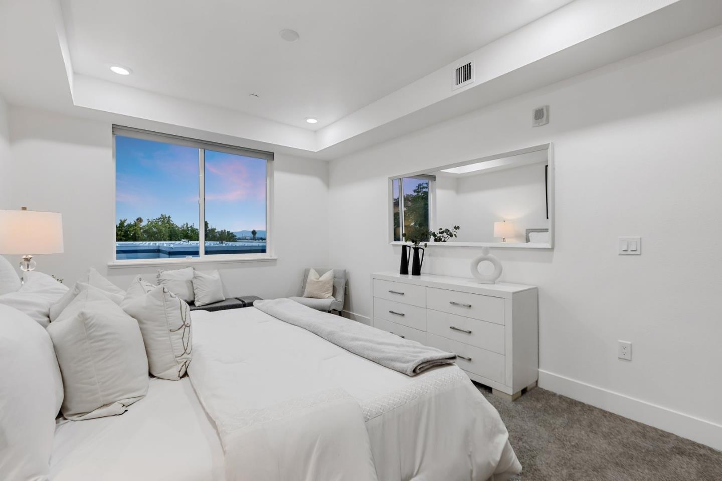 42111 Osgood Road, Unit 215 Fremont, CA 94539 - Photo 21 of 44 a bedroom with a bed and a dresser