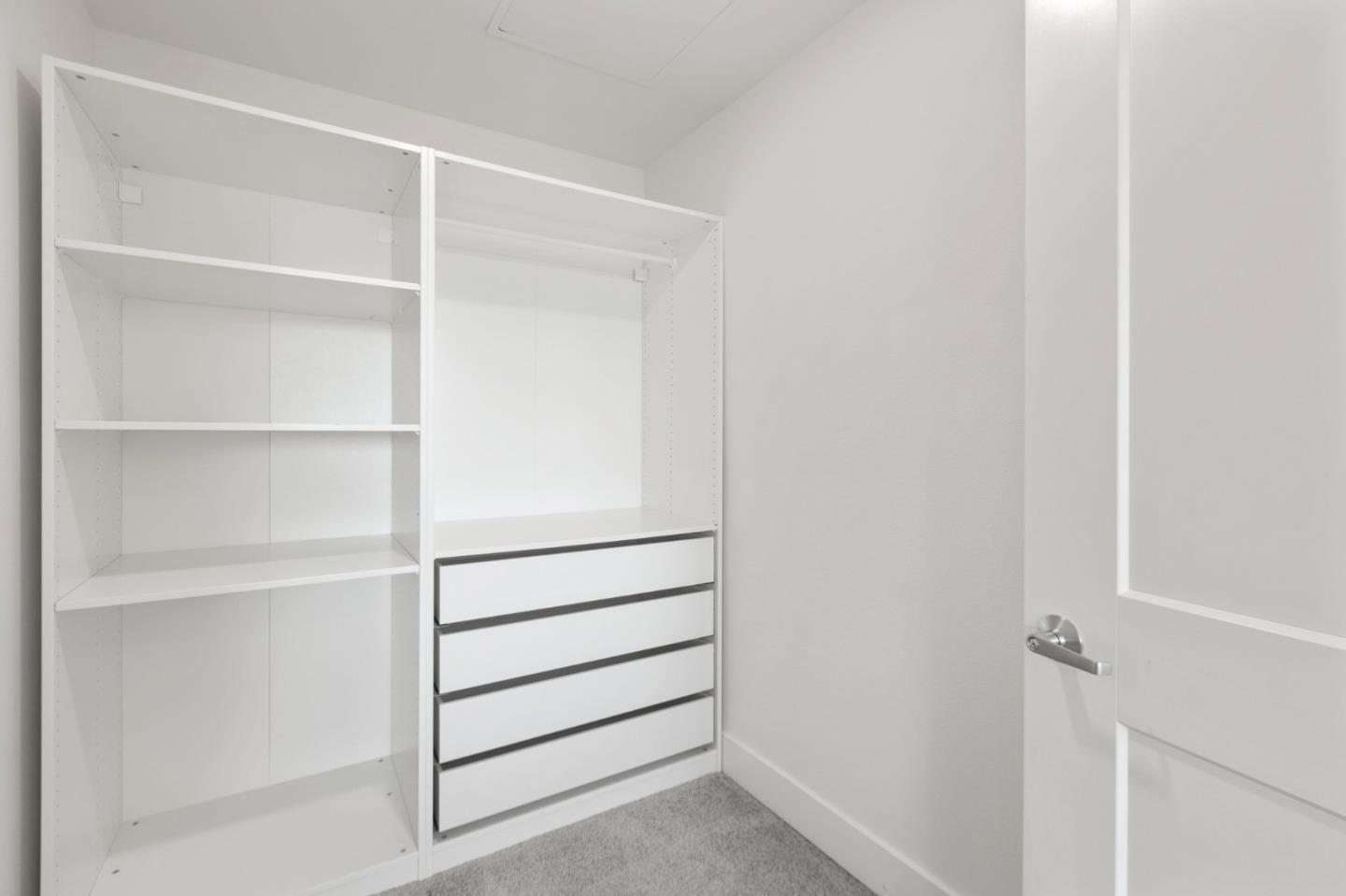 42111 Osgood Road, Unit 215 Fremont, CA 94539 - Photo 26 of 44 a view of walk in closet with empty racks