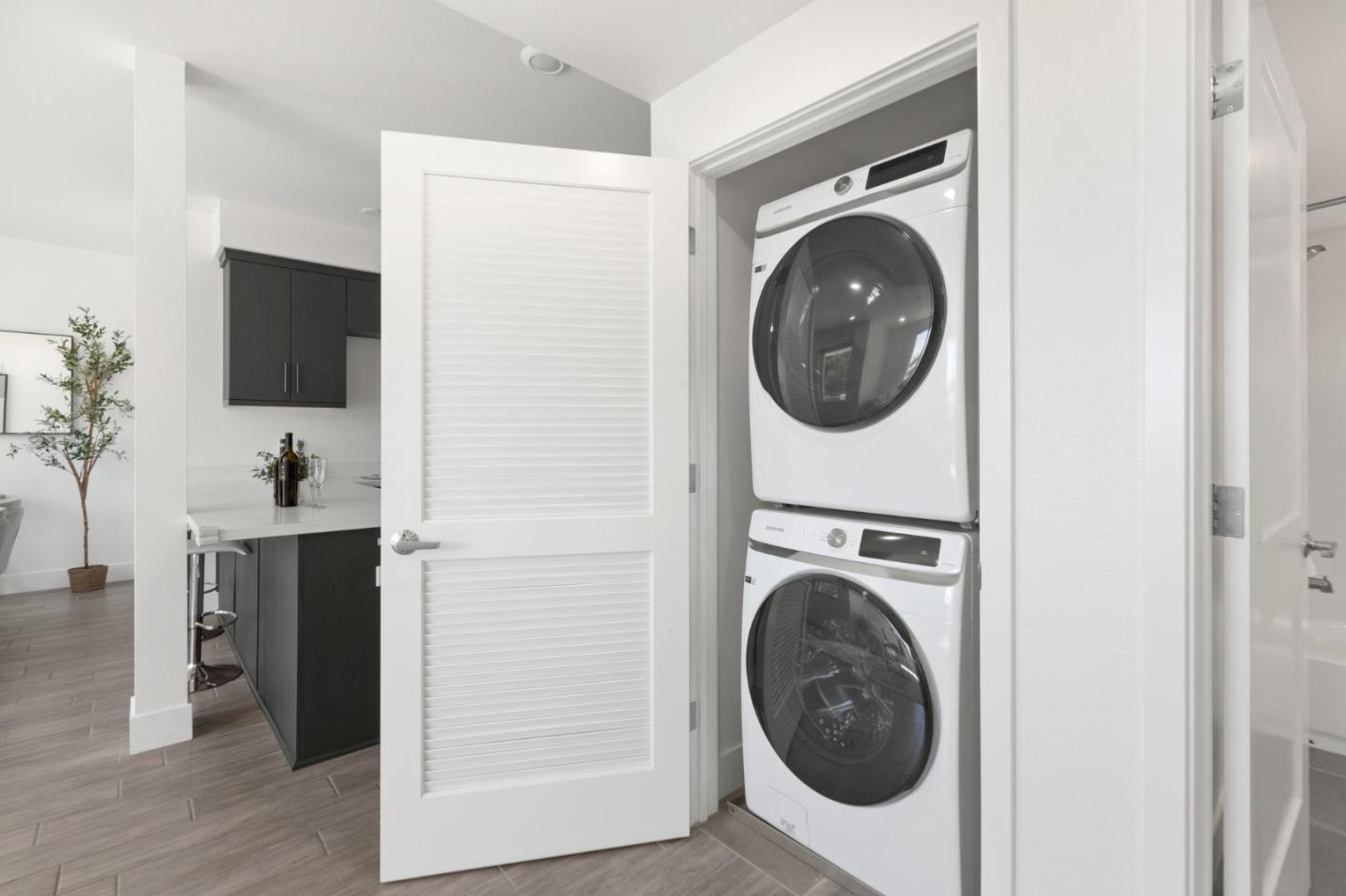 42111 Osgood Road, Unit 215 Fremont, CA 94539 - Photo 27 of 44 a view of a hallway with washer and dryer