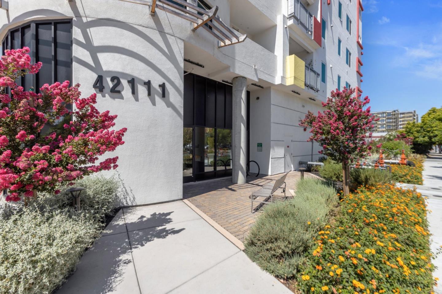 42111 Osgood Road, Unit 215 Fremont, CA 94539 - Photo 3 of 44 a front view of a house with a yard